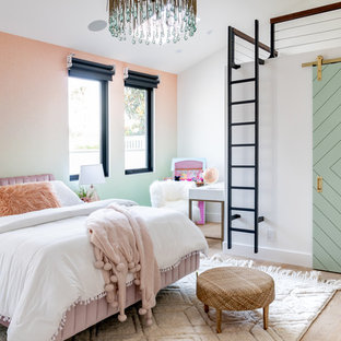 Kids' room - mediterranean girl light wood floor kids' room idea in Orange County with multicolored walls