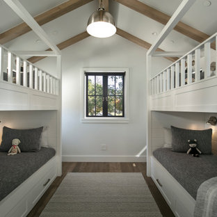 Farmhouse gender-neutral dark wood floor kids' room photo in Other with white walls