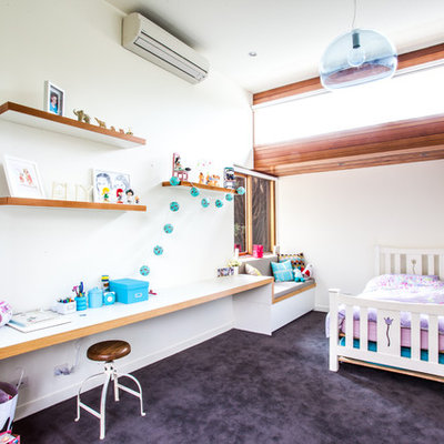 Minimalist girl carpeted kids' room photo in Melbourne with white walls