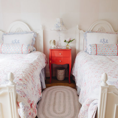 Elegant girl dark wood floor kids' room photo in San Francisco with beige walls