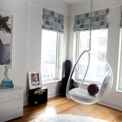 Large transitional gender-neutral light wood floor playroom photo in Seattle with white walls