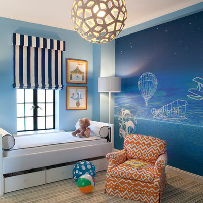 Kids' room - contemporary gender-neutral carpeted kids' room idea in New York with blue walls