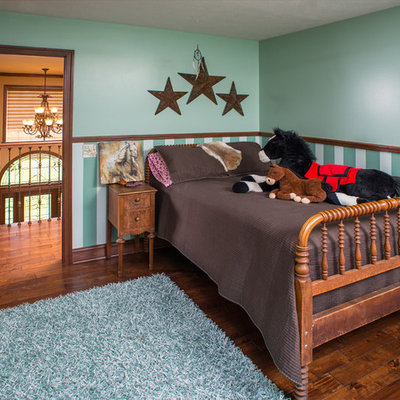 Elegant gender-neutral dark wood floor kids' room photo in Charleston with multicolored walls