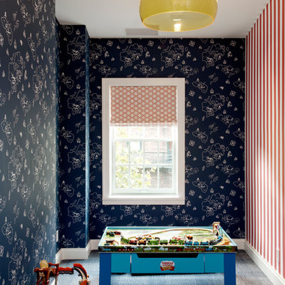 Example of a trendy boy carpeted playroom design in New York with multicolored walls