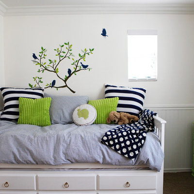 Eclectic gender-neutral carpeted kids' room photo in Orange County with white walls