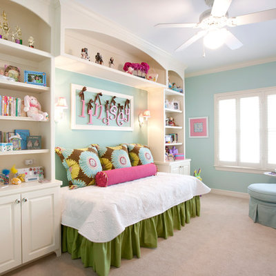 Example of a large classic girl carpeted kids' room design in Houston with blue walls