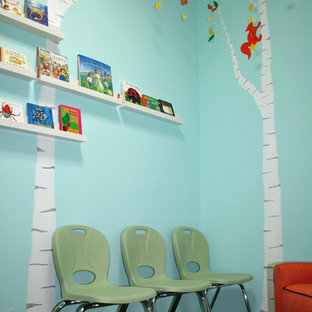 Inspiration for a small modern gender-neutral carpeted kids' room remodel in New York with blue walls