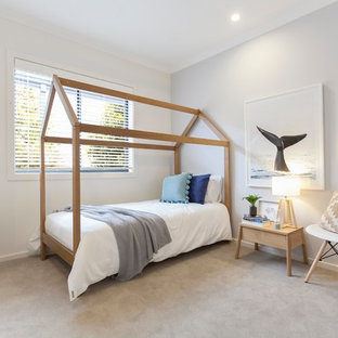 Inspiration for a beach style kids' room in Melbourne with grey walls, carpet and beige floor.