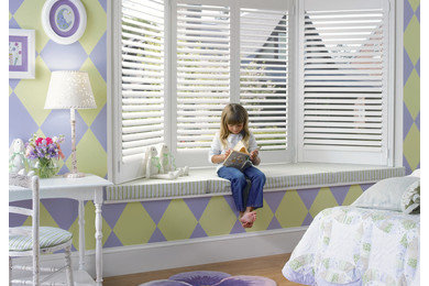 Example of a large eclectic girl medium tone wood floor kids' room design in Richmond with multicolored walls