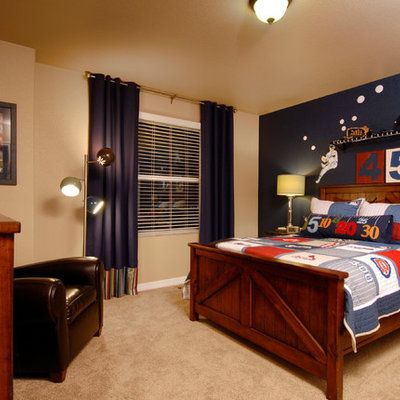 Example of a classic beige floor and carpeted kids' room design in Denver with multicolored walls
