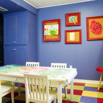 Example of a classic gender-neutral multicolored floor kids' room design in Minneapolis with purple walls