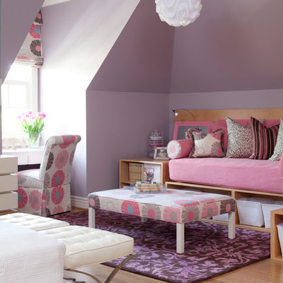 Kids' room - large traditional girl light wood floor kids' room idea in Little Rock with purple walls