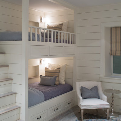 Example of a mid-sized transitional gender-neutral kids' bedroom design in Boston with white walls
