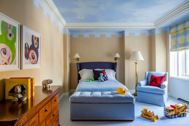 Kids' room - small transitional boy carpeted kids' room idea in New York with blue walls