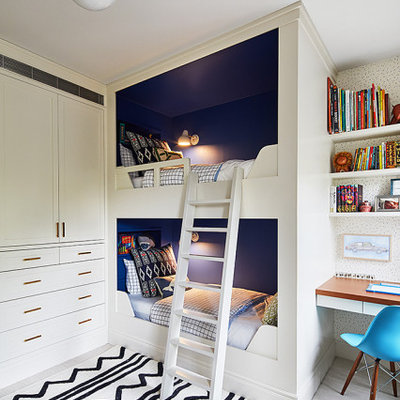 Mid-sized transitional gender-neutral carpeted kids' room photo in New York with blue walls