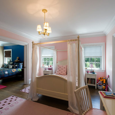 Large elegant girl dark wood floor kids' room photo in New York with pink walls