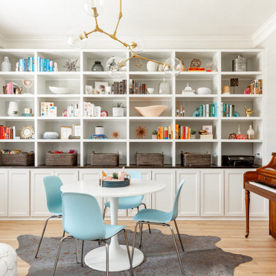 Transitional gender-neutral medium tone wood floor and brown floor kids' room photo in Dallas with beige walls