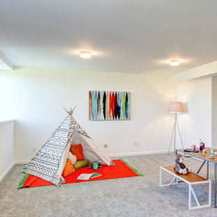 Large trendy gender-neutral carpeted playroom photo in Seattle with white walls