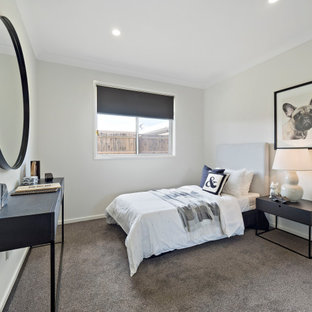 Photo of a mid-sized contemporary kids' room for girls in Brisbane with grey walls, carpet and grey floor.