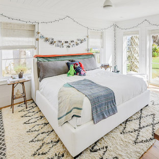Inspiration for a contemporary girl light wood floor kids' room remodel in Jacksonville with white walls