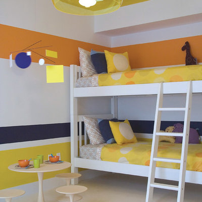 Example of a trendy gender-neutral kids' room design in Miami with multicolored walls