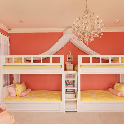 Example of a large trendy girl carpeted kids' room design in Los Angeles with pink walls