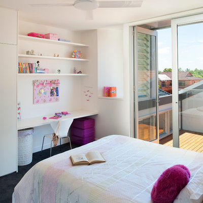 Kids' room - contemporary girl kids' room idea in New York with white walls