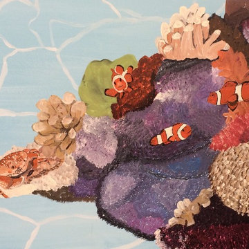 Coral, clownfish and a crab in the Stingray Mural