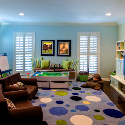 Example of a large classic boy dark wood floor and brown floor kids' room design in Tampa with blue walls
