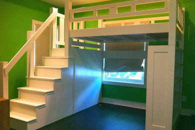 Mid-sized elegant gender-neutral concrete floor kids' room photo in Houston with green walls