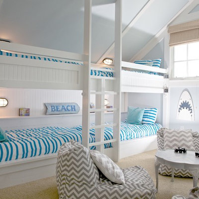 Inspiration for a coastal gender-neutral carpeted kids' room remodel in Other with blue walls
