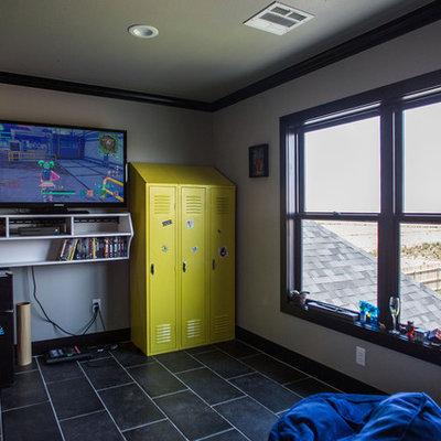 Kids' room - mid-sized modern boy ceramic tile and black floor kids' room idea in Other with gray walls