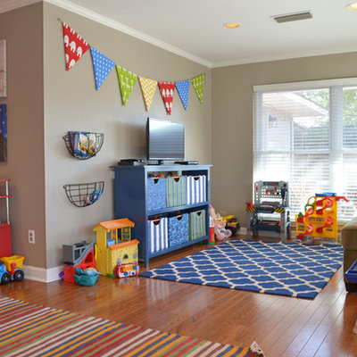 Example of a classic gender-neutral medium tone wood floor kids' room design in Dallas with beige walls