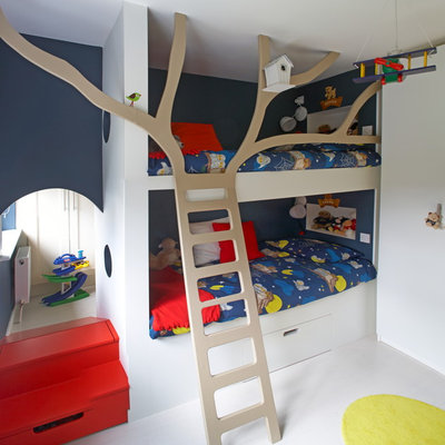 Kids' room - contemporary gender-neutral white floor kids' room idea in Dublin with blue walls