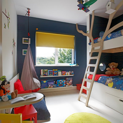 Inspiration for a contemporary gender-neutral white floor kids' bedroom remodel in Dublin with multicolored walls