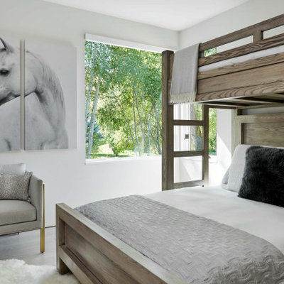 Example of a mid-sized trendy girl light wood floor and gray floor kids' room design in Denver with white walls