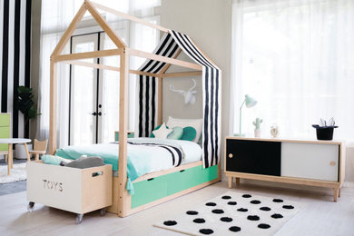 Minimalist gender-neutral kids' bedroom photo in Orange County