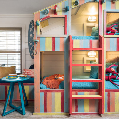 Mid-sized beach style gender-neutral ceramic tile and beige floor kids' room photo in Other with white walls