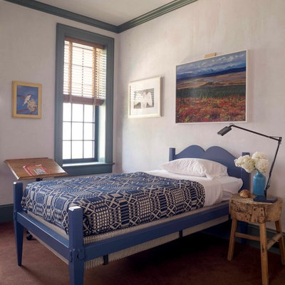 Example of an eclectic gender-neutral carpeted kids' room design in New York with white walls