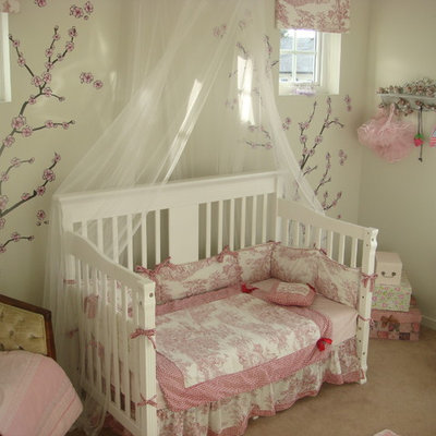 Example of an eclectic girl carpeted kids' bedroom design in Other with white walls