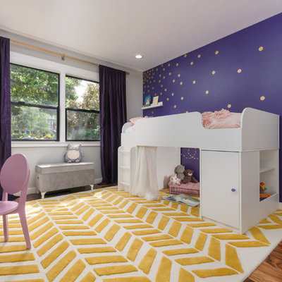 Inspiration for a mid-sized transitional girl medium tone wood floor kids' room remodel in San Francisco with purple walls
