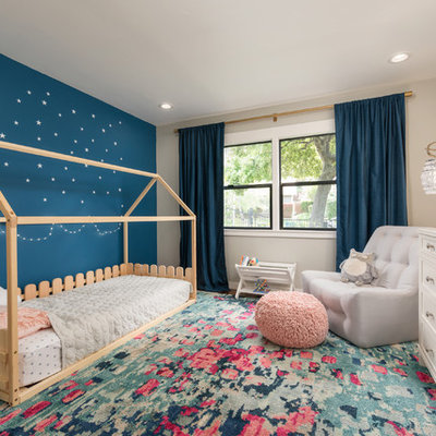 Kids' room - mid-sized transitional girl medium tone wood floor kids' room idea in San Francisco with multicolored walls