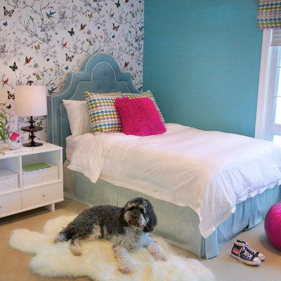 Inspiration for a timeless girl carpeted kids' room remodel in Los Angeles with multicolored walls