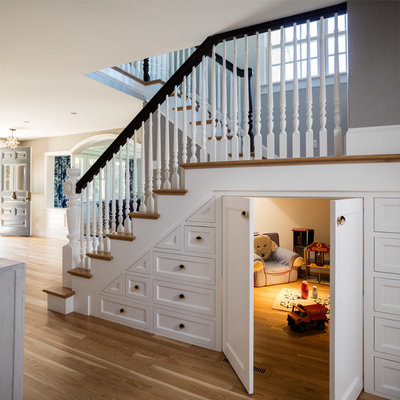 Example of a cottage medium tone wood floor and brown floor playroom design in Providence