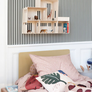 Inspiration for a scandinavian kids' bedroom in Melbourne with white walls, medium hardwood floors and brown floor.