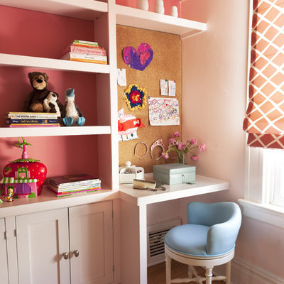 Example of a classic girl medium tone wood floor kids' room design in San Francisco with pink walls