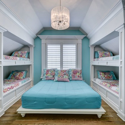Example of a mid-sized classic girl brown floor and dark wood floor kids' room design in Nashville with blue walls