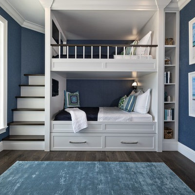 Kids' bedroom - coastal gender-neutral dark wood floor and brown floor kids' bedroom idea in Miami with blue walls