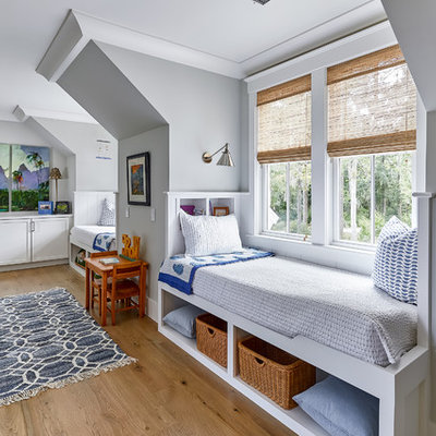 Inspiration for a coastal gender-neutral medium tone wood floor and brown floor kids' room remodel in Charleston with gray walls