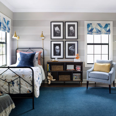 Example of a mid-sized classic boy medium tone wood floor and brown floor kids' room design in Tampa with beige walls